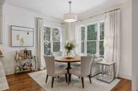 Breakfast nook in rear corner of main level offers daylight and views of the backyard.