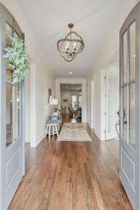 Entry foyer and central hallway on main living level.