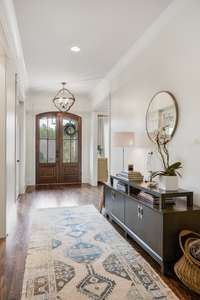 Entry foyer and central hallway on main living level.