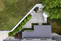 Backyard oasis features wonderful cabana porch, outdoor dining and wood burning fireplace (w/gas).