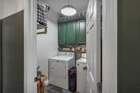 The utility room features adorable green cabinets and a shelf perfect for displaying trinkets or additional storage. 8699 Christiana Fosterville Rd   Christiana, TN  37037