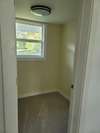 Bedroom 2's walk-in closet w/ window for lots of natural light - perfect for a vanity!