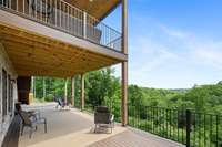 Breathtaking back decks spanning over 1,700 square feet with stunning, east-facing forest views