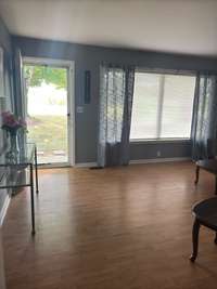 another view of the living room towards the front door.