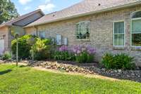 Beautiful flowers and plants adorn the property.