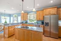 The kitchen has plenty of cabinet and counter space.