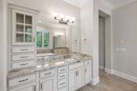 Dual vanities with drawer stacks in each, granite counter tops, and private water closet finish out the space.