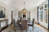 This formal dining room is bathed in natural light, creating an inviting atmosphere that's perfect for gatherings.