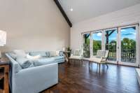 Family room with plenty of natural light- Doors lead to back covered porch with Fireplace