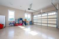 2 car Garage with protective floor coating-- Another 2 car garage attached to the Porte Cochere =  a 4 car garage in this home!