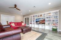 Bonus room is located in the walk out basement with a wall of shelving