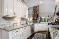 Abundance of leathered granite counter space- Open to the Family Room and Eating Area