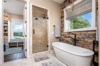 Aww that soaking tub and walk in shower welcomes you in the Primary Suite