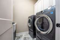 Laundry Room with storage and a wash sink