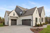 Oversized 3 car carriage style garage with 8' tall garage doors. ACTUAL HOME UNDER CONSTRUCTION - Same plan as Pasadena Model Home. ALL photos of similar homes & NOT actual home.