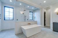 Getting ready each morning is a real treat when you're greeted with a shower and soaking tub as lovely as this one!