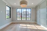 View of Private Guest Suite on Main level with framed wall millwork