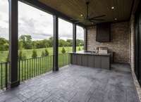 Outdoor kitchen with dining area and bar seating