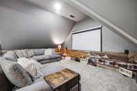 The room is trimmed with historic tin and framed with restored barn wood.