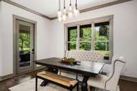 The Dine-in Kitchen over looks the stunning nature view as well as  another access door to the covered porch.