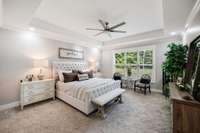 Primary Bedroom with vast windows allowing the natural landscape to shine.