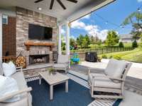 Wood burning fireplace on covered back patio