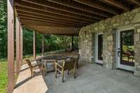 patio off the bottom level near the pool