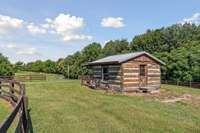 This is a little hang-out cabin where the family lounges at the firepit.