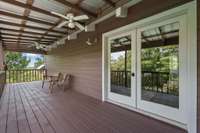 doors that lead out to the deck/porch area from the primary room