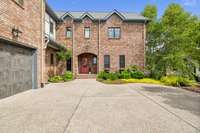 Not only does a three car garage hold all your cars & toys, the driveway has plenty of parking for guests!