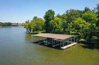 The third slip from the left is YOUR slip! Inside slips protect your boat from the sun and a community dock means the maintenance is split four ways! NEW DOCK IS COMING SOON due to tornado damage.