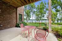 This cute covered patio opens off the basement for lake access