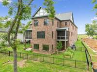 This beautiful home has not only a big screened in porch with a fireplace for relaxing views of the lake and wildlife, but also a GRILLING PORCH just outside the kitchen window making it convenient to pass the steaks!