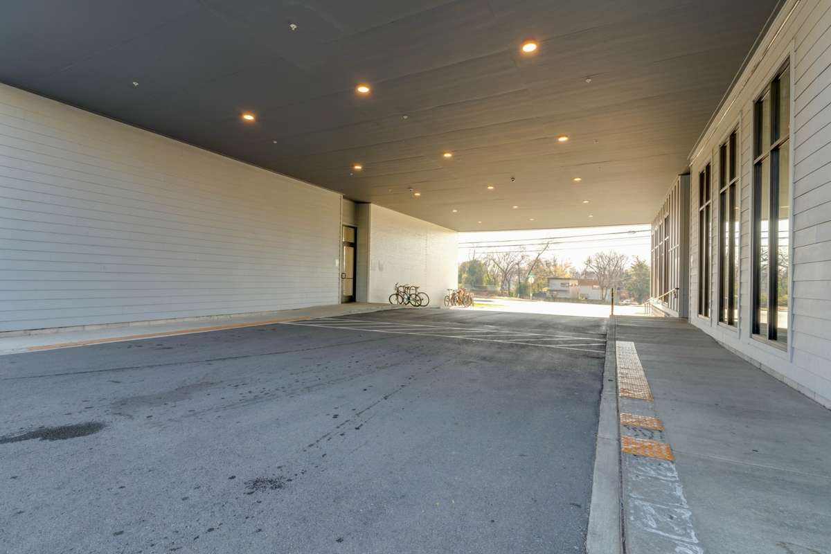 Driveway leading to parking area in back of the building