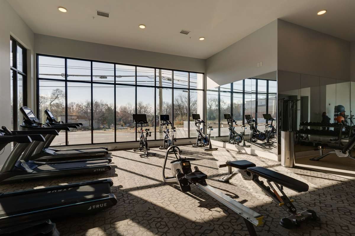 Fully outfitted gym with Peloton bikes