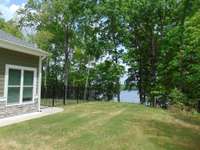 Backyard facing North with double gate for lawn service.