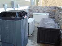 HVAC area with natural gas Generac 18KW whole house backup generator.