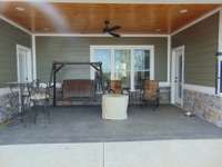 Covered back patio with natural gas fire pit