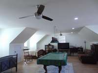 Super bonus room with room for 2 queen beds or more, pool table, TV and furniture plus full bath.