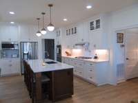 Kitchen view and pantry door to right.