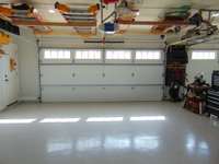 16 foot R-19 garage door.  There is a floor drain in each bay.