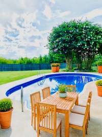 Virtual Staged accompany this beautiful inground pool for those hot summer days.