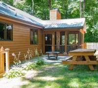 Backyard is fenced in with two patios and a screened-in porch.