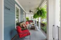 New hand-forged iron railing and newly stained concrete porch