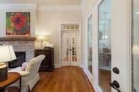 French doors leading to the Primary bedroom, laundry room, and back staircase