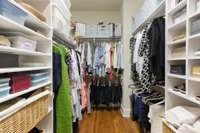 His/Her Closets with shelving and automatic lighting