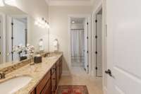 Jack-n-Jill bath with double vanities and full tile shower