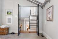 Custom glass doors transition main house to recreation space