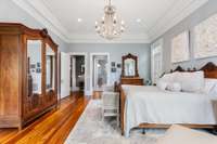 Reclaimed heart pine floors and a stylish progression to the primary bathroom