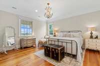 circular hallway and railing lead to upstairs bedroom and loft to upper porch